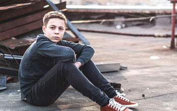 Sad-Boy-Sitting-Alone